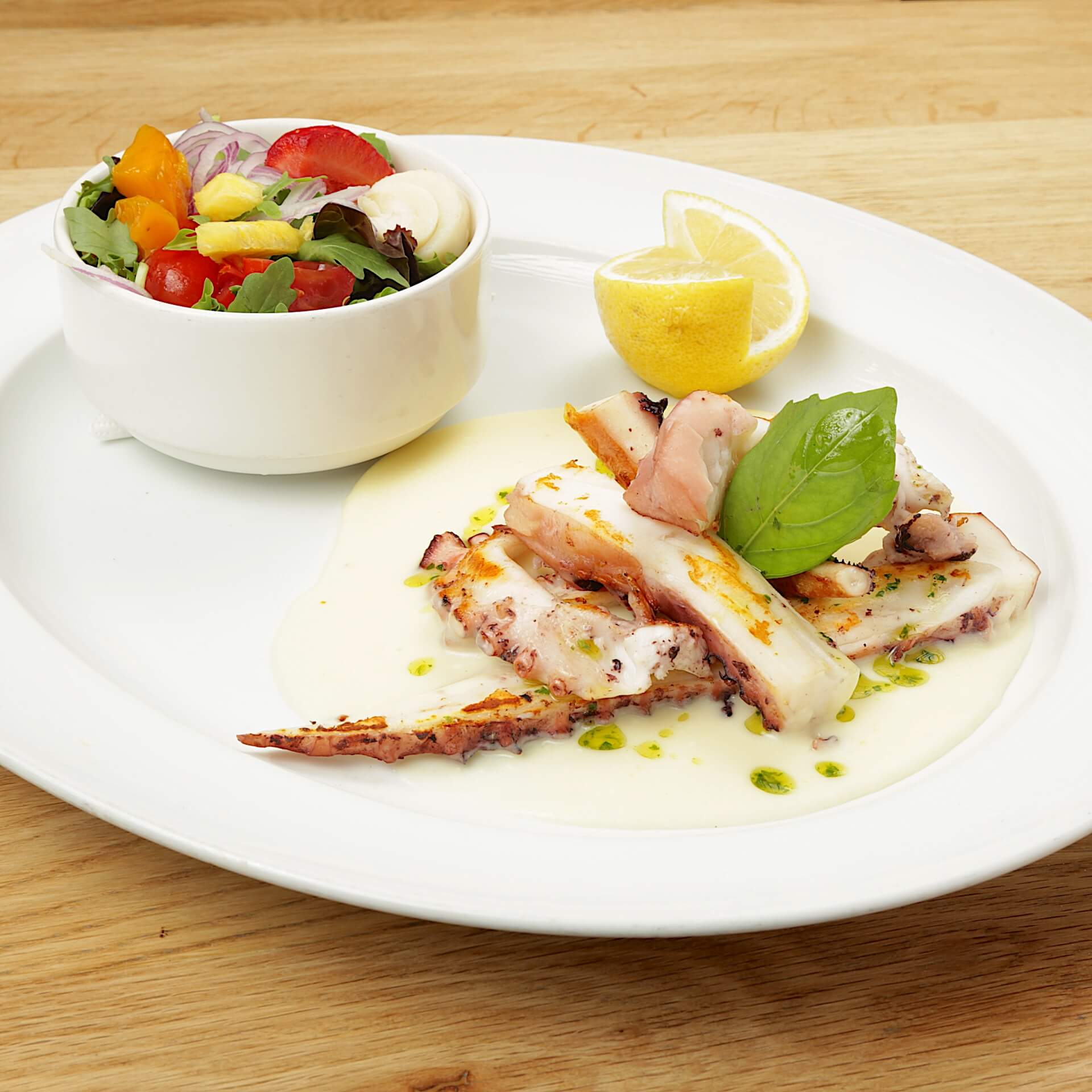 Duo of grilled octopus tentacles & squids - Bella Vita | Italian & French Cuisine Delivery in Monaco, Cap-d'Ail & Beausoleil