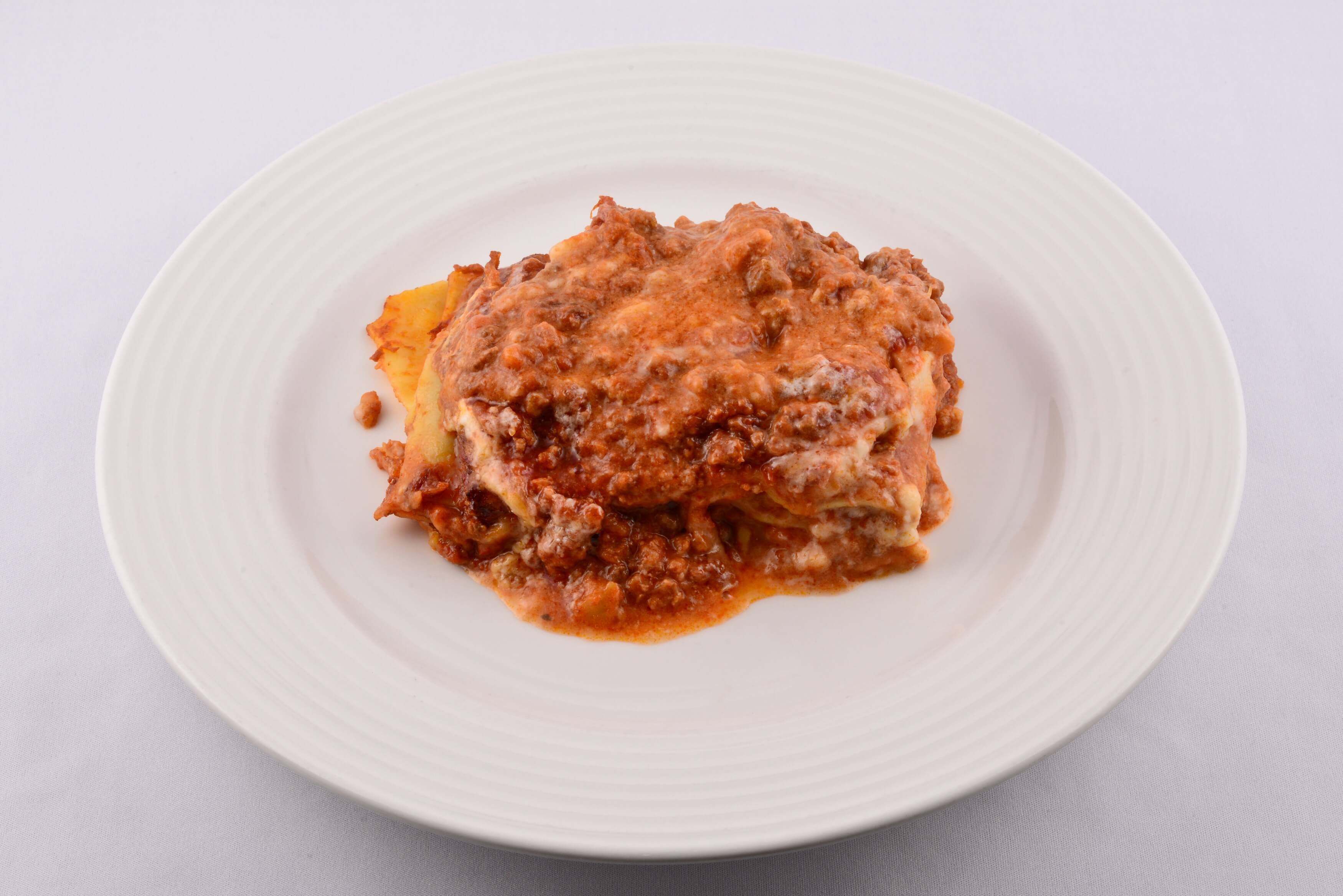 Lasagna Bolognese - Pulcinella | Traditional Italian Pizza Delivery in Monaco
