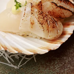 Scallop flambé - 99 Sushi Bar