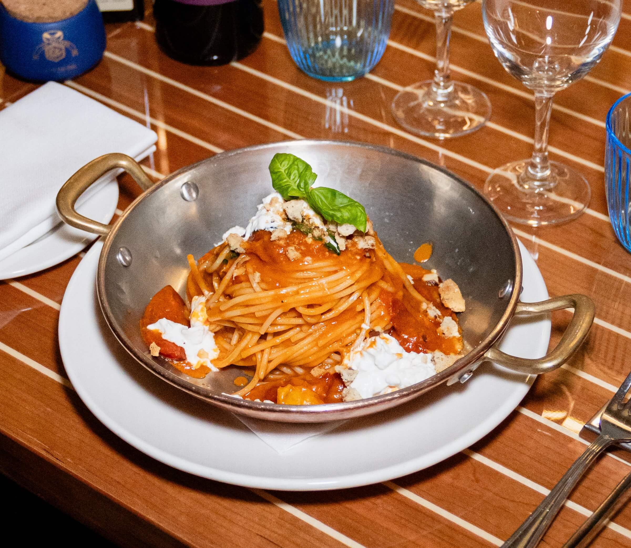 Spaghetti with Piennolo Cherry Tomatoes, Basil, Stracciatella, and Savory Biscuit Crumble - La Saliere | Italian & Mediterranean Food Delivery in Monaco, Cap-d'Ail
