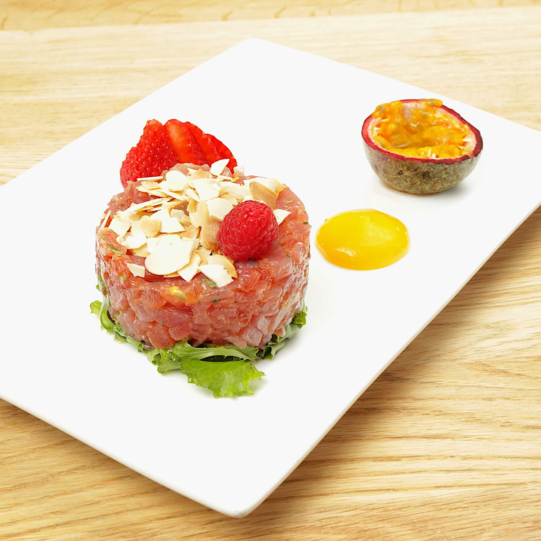 Tuna tartare, passion fruit, toasted almonds, mango cream - Bella Vita | Italian & French Cuisine Delivery in Monaco, Cap-d'Ail & Beausoleil